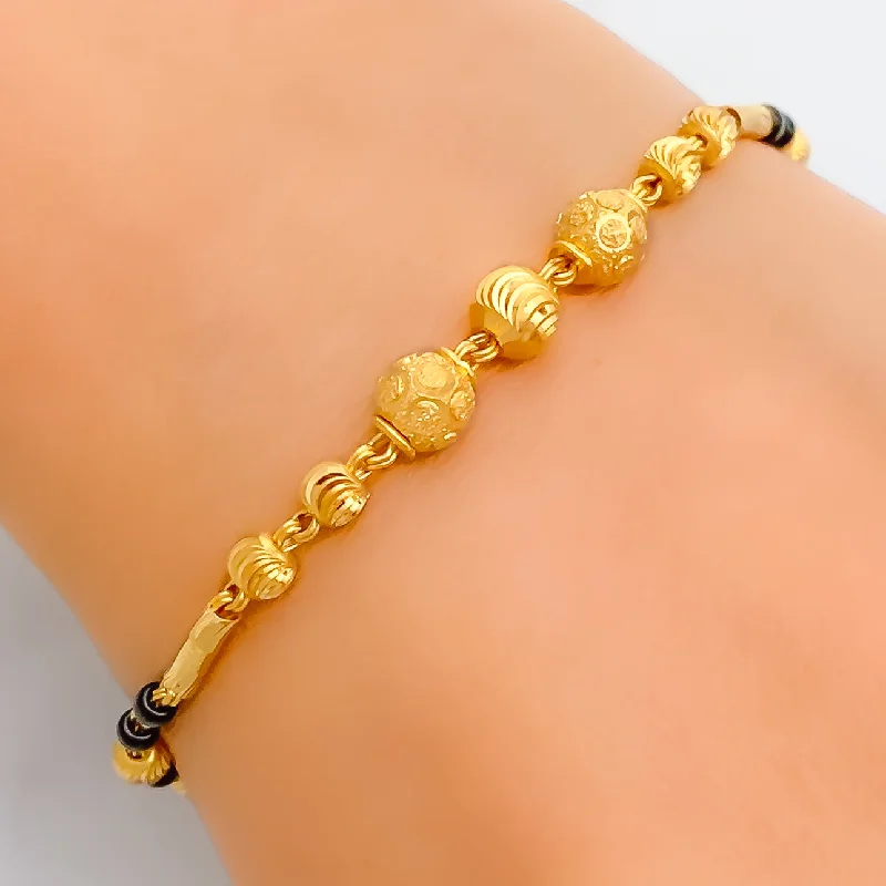 Women’s diamond tennis bracelets-Regal Sophisticated 2k Gold Black Bead Bracelet