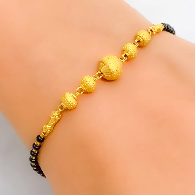 Women’s toggle bracelets-Fashionable Elevated 22k Gold Black Bead Bracelet